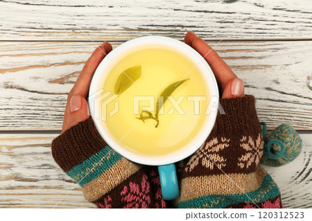 Woman hands hold full latte cappuccino coffee cup 120312523