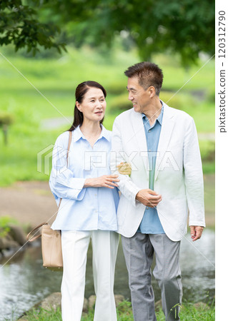 Senior couple taking a walk 120312790
