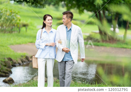 Senior couple taking a walk Senior couple taking a walk 120312791