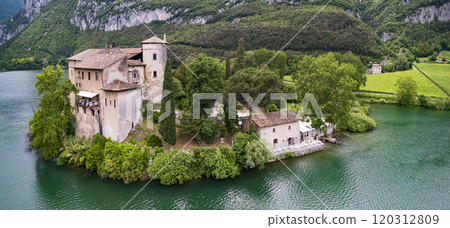 Beautiful Toblino lake is considered one of the most romantic lakes in the Trentino, Italy. aerial drone panoramic view with medieval castle. Sarca Valley 120312809