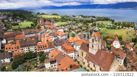 Switzerland scenic places. Estavayer-le-lac - charming traditional village, lake Neuchatel. aerial drone video of medieval castle. Canton Fribourg Switzerland scenic places. Estavayer-le-lac - charming traditional village, lake Neuchatel. aerial drone video of medieval castle. Canton Fribourg 120312822