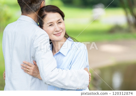 Senior couple with cuddling smile 120312874