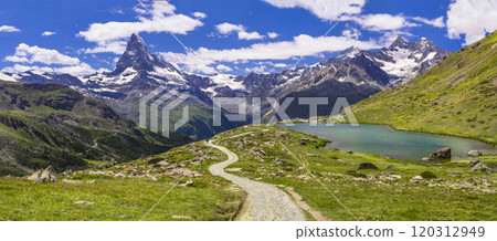 famous hiking routes in Switzerland , Valais canton - five most beautiful mountain lakes in Zermatt. Panoramic view of Stellisee lake and Matterhorn iconic mountain famous hiking routes in Switzerland , Valais canton - five most beautiful mountain lakes in Zermatt. Panoramic view of Stellisee lake and Matterhorn iconic mountain 120312949
