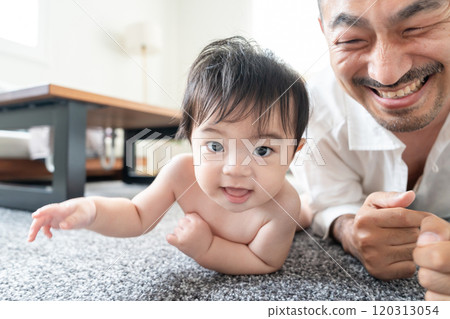 Dad playing with baby 120313054