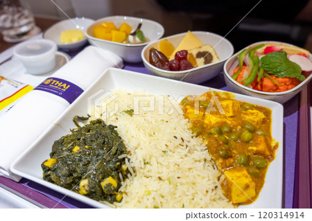 Saag paneer and curry vegetarian meal served on board 120314914