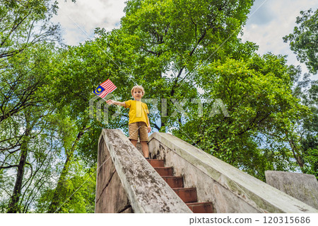 Boy travels in malaysia with malaysia flag celebrating the Malaysia independence day and Malaysia day. Travel to Malaysia concept 120315686