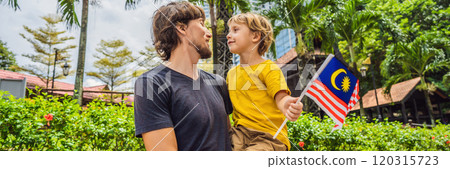 Father and son travelers in malaysia with malaysia flag celebrating the Malaysia independence day and Malaysia day. Travel to Malaysia concept BANNER, LONG FORMAT Father and son travelers in malaysia with malaysia flag celebrating the Malaysia independence day and Malaysia day. Travel to Malaysia concept BANNER, LONG FORMAT 120315723