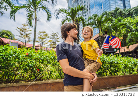 Father and son travelers in malaysia with malaysia flag celebrating the Malaysia independence day and Malaysia day. Travel to Malaysia concept 120315728