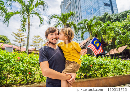 Father and son travelers in malaysia with malaysia flag celebrating the Malaysia independence day and Malaysia day. Travel to Malaysia concept 120315733