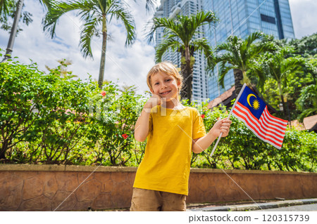 Boy travels in malaysia with malaysia flag celebrating the Malaysia independence day and Malaysia day. Travel to Malaysia concept 120315739