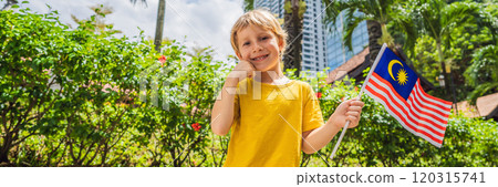 Boy travels in malaysia with malaysia flag celebrating the Malaysia independence day and Malaysia day. Travel to Malaysia concept BANNER, LONG FORMAT 120315741