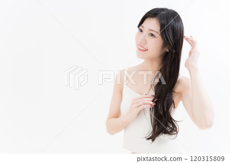 Young woman taking care of her hair 120315809
