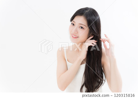 Young woman taking care of her hair 120315816