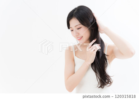 Young woman taking care of her hair 120315818