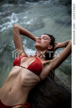 A Relaxing Woman in a Bikini Enjoying Her Time by the Beautiful Beach and Ocean Waves A Relaxing Woman in a Bikini Enjoying Her Time by the Beautiful Beach and Ocean Waves 120315825