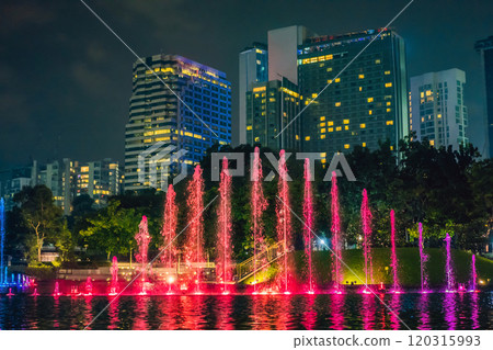 The colorful fountain on the lake at night with city on background. Kuala Lumpur, Malaysia 120315993