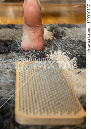 A woman comes down from the sadhu boards.  120316197