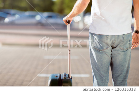Airport taxi. Passenger waiting for cab with baggage, standing outdoors, free space 120316338
