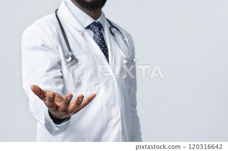 Cropped of african therapist outstretching empty hand towards camera, white background, copy space 120316642