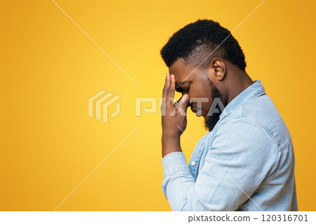 Problems concept. Depressed african american man touching his forehead deep in thoughts, trying to find solution, panorama with copy space Problems concept. Depressed african american man touching his forehead deep in thoughts, trying to find solution, panorama with copy space 120316701