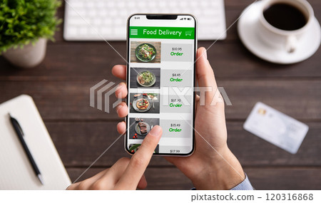 Food delivery. Businessman choosing meal for lunch in takeaway restaurant service on mobile application on smartphone 120316868