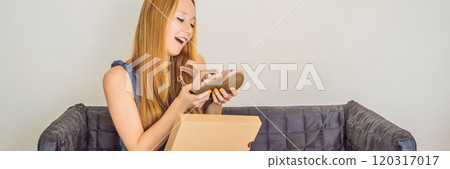 young woman received online shopping parcel opening boxes and buying fashion items by using credit card BANNER, LONG FORMAT young woman received online shopping parcel opening boxes and buying fashion items by using credit card BANNER, LONG FORMAT 120317017