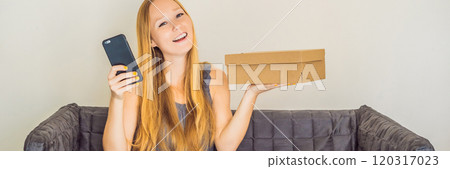 young woman received online shopping parcel opening boxes and buying fashion items by using credit card BANNER, LONG FORMAT young woman received online shopping parcel opening boxes and buying fashion items by using credit card BANNER, LONG FORMAT 120317023
