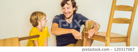 Father and son assembling furniture. Boy helping his dad at home. Happy Family concept BANNER, LONG FORMAT 120317067