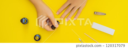 Woman Hands Care. Top View Of Beautiful Smooth Woman's Hands With Professional Nail Care Tools For Manicure On yellow Background. Closeup Of Healthy Female Nails With yellow Nail Polish. High 120317079