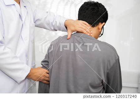 Physical therapy, Asian therapist doctor treat perform pain young man in hospital. Physical therapy, Asian therapist doctor treat perform pain young man in hospital. 120317240