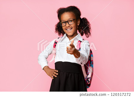 Hey, you. Cute Afro Elementary Student Girl Pointing Finger At Camera On Yellow Background In Studio. Copy Space Hey, you. Cute Afro Elementary Student Girl Pointing Finger At Camera On Yellow Background In Studio. Copy Space 120317272
