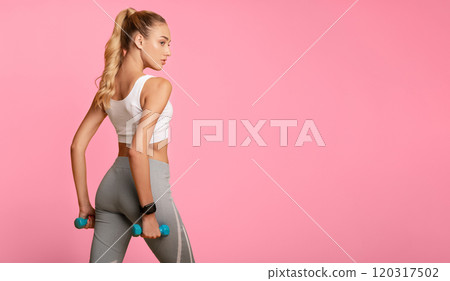 Sporty Woman Posing With Dumbbells Over Yellow Studio Background. Workout Concept. Copy Space Sporty Woman Posing With Dumbbells Over Yellow Studio Background. Workout Concept. Copy Space 120317502