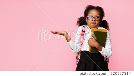 I Don't Know. Puzzled Black School Girl Shrugging Shoulders Holding Books On Yellow Studio Background. Free Space, Panorama 120317514