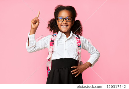 Great Idea. Nerdy African American Schoolgirl Pointing Finger Up Having Question On Yellow Studio Background. 120317542