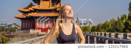 Enjoying vacation in China. Young woman in Forbidden City. Travel to China concept. Visa free transit 72 hours, 144 hours in China BANNER, LONG FORMAT Enjoying vacation in China. Young woman in Forbidden City. Travel to China concept. Visa free transit 72 hours, 144 hours in China BANNER, LONG FORMAT 120317968