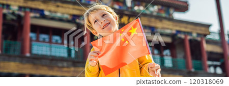 Enjoying vacation in China. Young boy with national chinese flag on the background of the old Chinese street. Travel to China concept. Visa free transit 72 hours, 144 hours in China BANNER, LONG 120318069