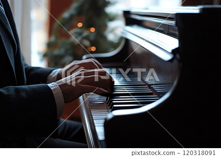 Musician playing grand piano on stage wearing suit 120318091