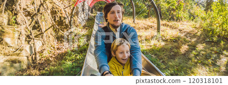 Dad and son have fun on alpine roller coaster BANNER, LONG FORMAT Dad and son have fun on alpine roller coaster BANNER, LONG FORMAT 120318101