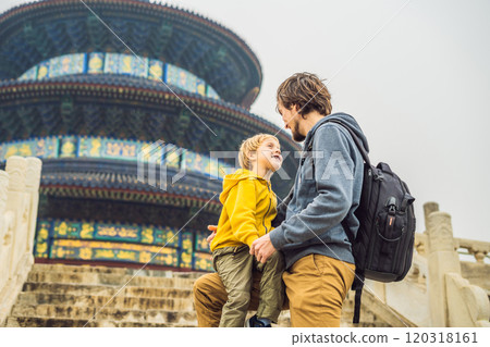 Dad and son travelers in the Temple of Heaven in Beijing. One of the main attractions of Beijing. Traveling with family and kids in China concept Dad and son travelers in the Temple of Heaven in Beijing. One of the main attractions of Beijing. Traveling with family and kids in China concept 120318161