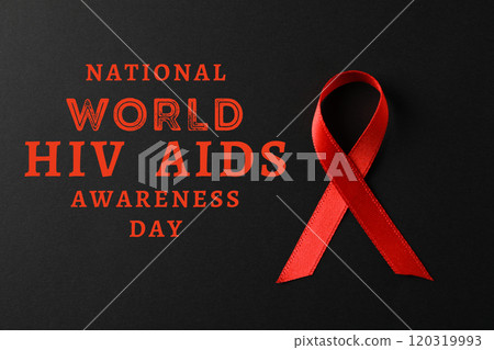 AIDS day, red ribbon on black background with text 120319993