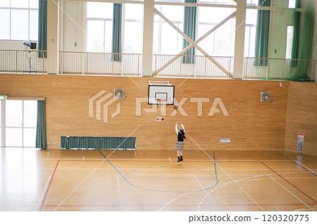 Junior high school girls playing basketball in the gym Junior high school girls playing basketball in the gym 120320775