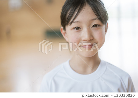 Girl in gym clothes looking at camera 120320820