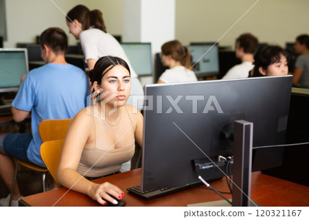 Teenager girl using PC during computer science lesson Teenager girl using PC during computer science lesson 120321167