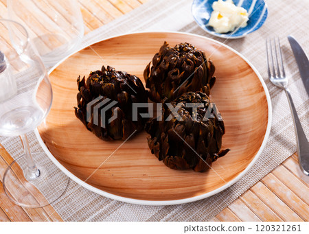 Top view of vegetarian appetizer of baked artichokes served on plate Top view of vegetarian appetizer of baked artichokes served on plate 120321261