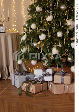 Gifts under the Christmas tree in the living room Gifts under the Christmas tree in the living room 120321267