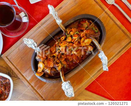 Turkish lamb chops baked with mushrooms and vegetables 120321271