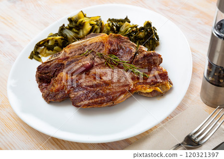 Top view on grilled beef with chard 120321397
