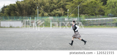 Japanese female junior high school students running on the school grounds Japanese female junior high school students running on the school grounds 120321555