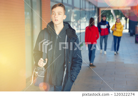Teenage student on way to college 120322274