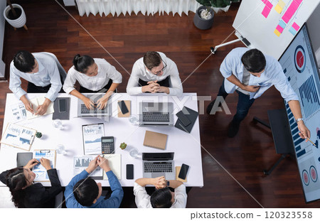 Analyst team utilizing BI Fintech to analyze financial data at table. Prudent Analyst team utilizing BI Fintech to analyze financial data at table. Prudent 120323558